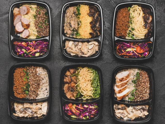 Containers with healthy food on dark background Containers with healthy food on dark background